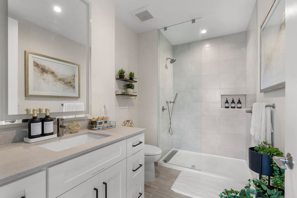 [King Suite Bathroom] - walk-in shower, complimentary toiletries, straightener, hair dryer