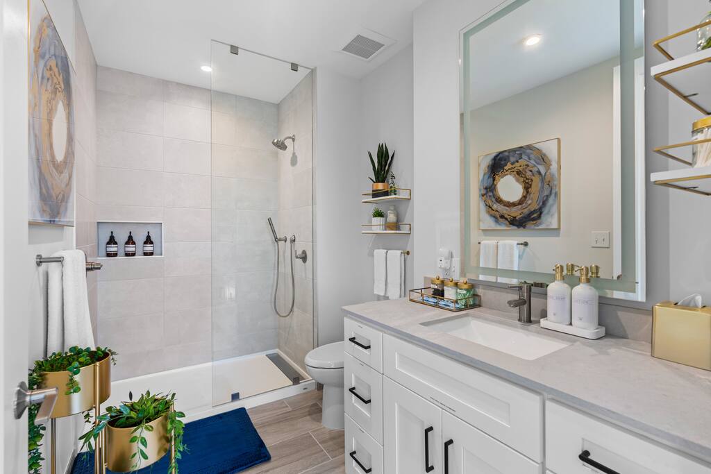 [King Suite Bathroom] - walk-in shower, complimentary toiletries, straightener, blow dryer